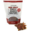 A package of Wooftown Beef Jerky Single Source Wafers for dogs, showcasing a few wafer pieces in front of it. 