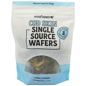 A package of Wooftown Cod Skin Single Source Wafers for dogs, featuring a light blue and white design, labeled &#39;Natural Treats for Dogs.&#39;