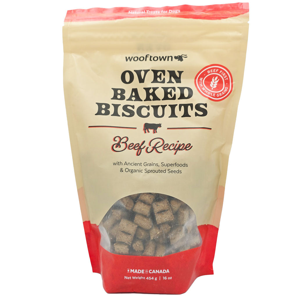 Package of Wooftown Oven Baked Biscuits, Beef Recipe for dogs, featuring ancient grains and organic seeds, 16 oz made in Canada.