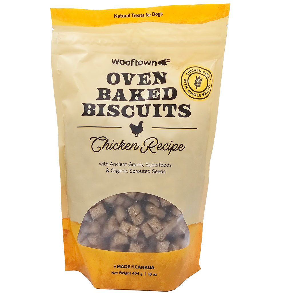 A bag of Wooftown Oven Baked Biscuits featuring a chicken recipe, highlighted with ancient grains and superfoods for dogs.