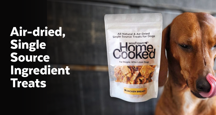a phtoto of a dog licking his lips next to a bag of Wooftown Treats with the text that reads Air-dried Single Source Ingredient Treats