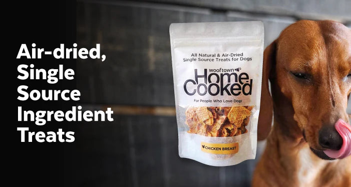 a phtoto of a dog licking his lips next to a bag of Wooftown Treats with the text that reads Air-dried Single Source Ingredient Treats